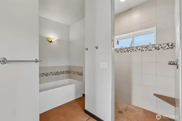 Custom tiled shower and soaking tub.