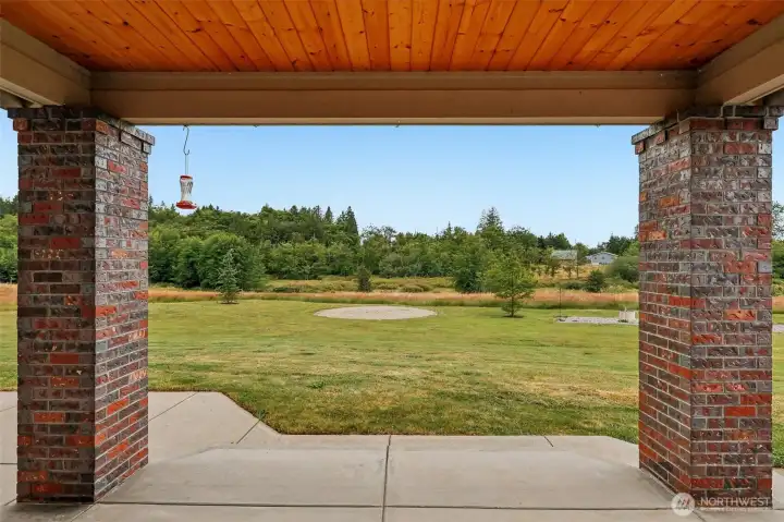 Covered patio area with custom masonry design.