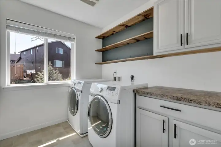 Oversize laundry room with generous storage and folding table! Oversize laundry room with generous storage and folding table!