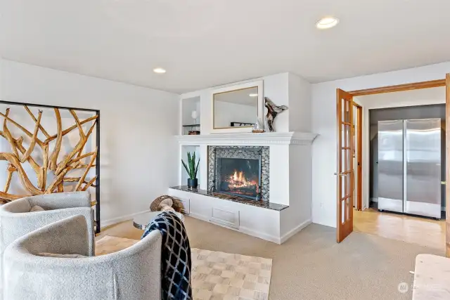 A cozy fireplace anchors the family room, adding warmth and charm.