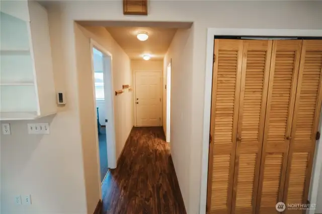 Closet for washer/dryer and hallway to the backdoor.