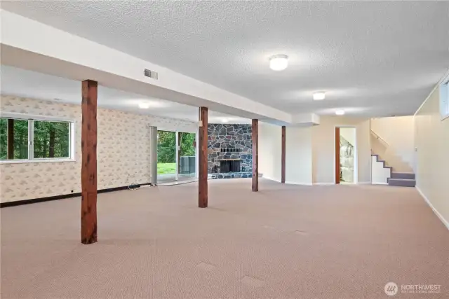 Fireplace and sliding doors leading to the covered patio...