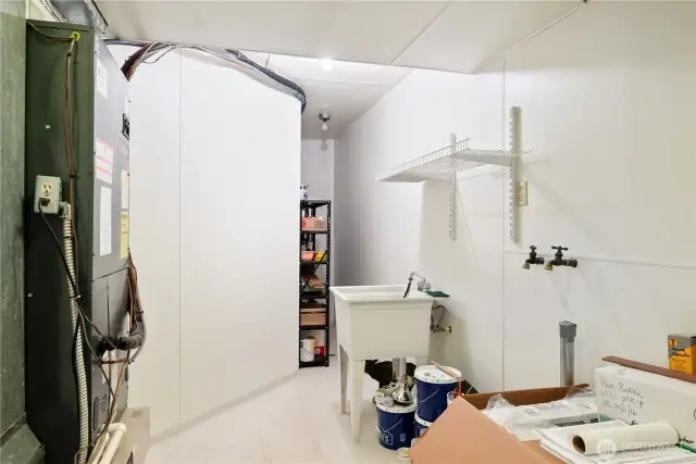 Laundry area downstairs and it has plumbing for a toilet