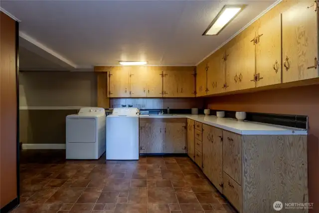 Multipurpose room with laundry, and utility systems. Great space to create a second kitchen!