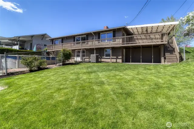 Large backyard complete with pool, garden space, dog run and Stone Creek running along the border.