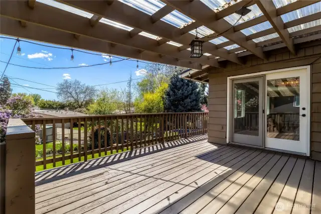 Upper deck with access from Dining area. Stairs to lower yard and pool.