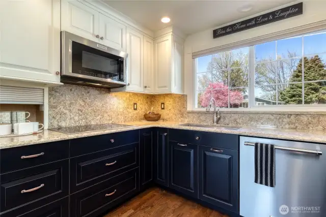 Convection Microwave, electric cooktop and convenient appliance garage.