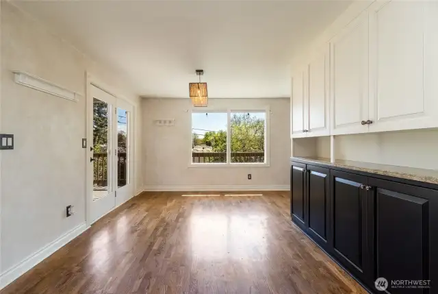 Dining room with built in hutch. Access door to upper deck, a perfect spot to BBQ and entertain friends.
