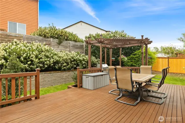 The peaceful backyard has expansive decks, for lower maintenance and ease of use in all seasons!