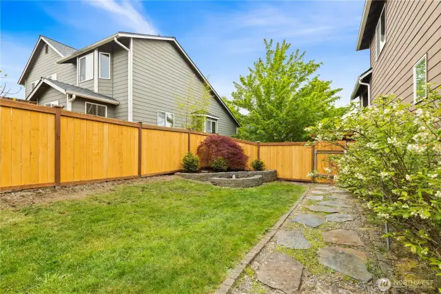 Great side yard with bountiful blueberry bushes! They're about to fruit!