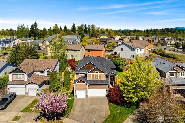 Your lot lines extend to the edge of the grass on the right! Lots of room to relax and play in the front
