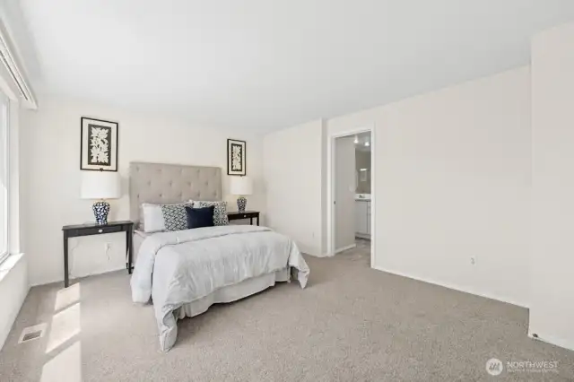 Another look at the primary suite and its connection to the attached, three-quarter bath.