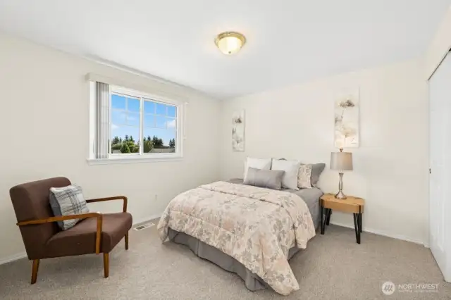 The second of the three upper-level bedrooms.