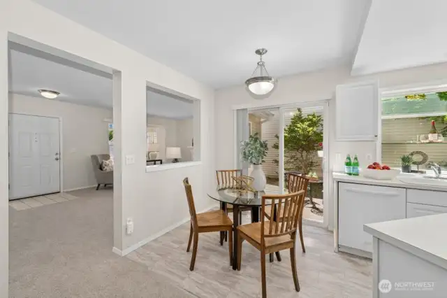 The everyday eating area features a slider to the back patio — perfect for al fresco dining and outdoor entertaining!