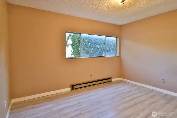 Spacious bedroom with new floors.