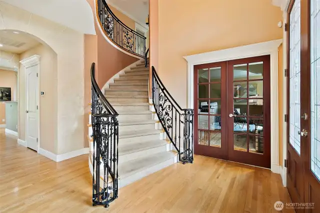 Once inside the soaring ceilings and sweeping wrought iron staircase provide the look of pure elegance.  The rich hardwood floors flow throughout the main living area. The elegant design of this home continues with an abundance of natural light and refined architectural details.