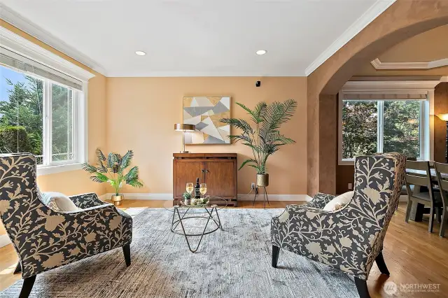 The living room is inviting with warm paint tones, hardwoods and an extensive white millwork package and crown molding that is abundant throughout the home. Living room opens to a grand dining room ideal for entertaining.