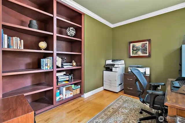 The main floor den has ample built-ins and French doors which provide the ideal work-from-home set-up.