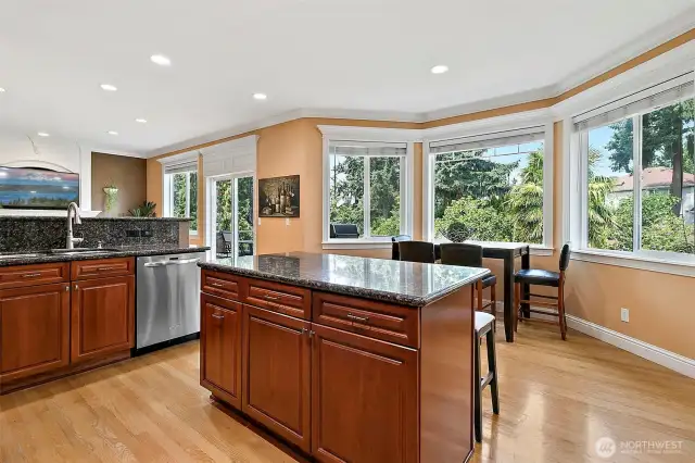 A lovely seating area where you can enjoy the beautiful view of the private backyard from the large windows.