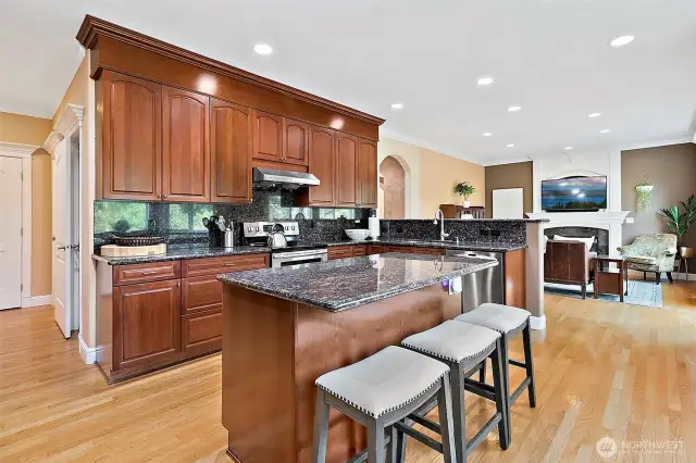 Large center island offers bar seating perfect for casual meals, morning coffee or entertaining guests.