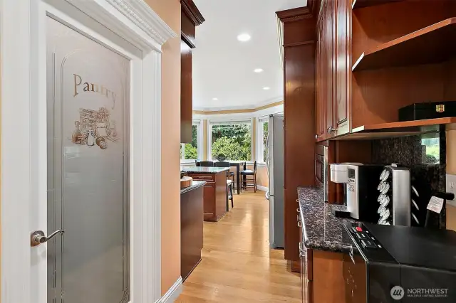 Dedicated coffee bar area adds a custom touch perfect for your morning routine or displaying favorite mugs and essentials.