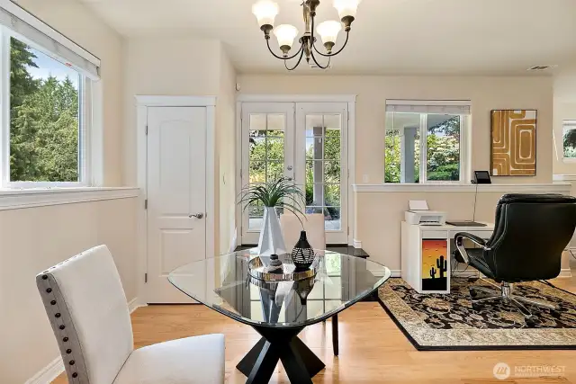 Cozy dining area in the lower level with plenty of natural light plus additional space for a home office setup or workstation, ideal for remote work or study.