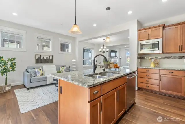 Kitchen flows seamlessly to family room and dining area.