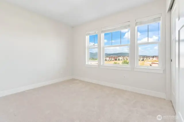 Guest bedroom #2 on upper level, with views of the mountain and sunset.