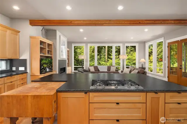 Kitchen faces wide open living area