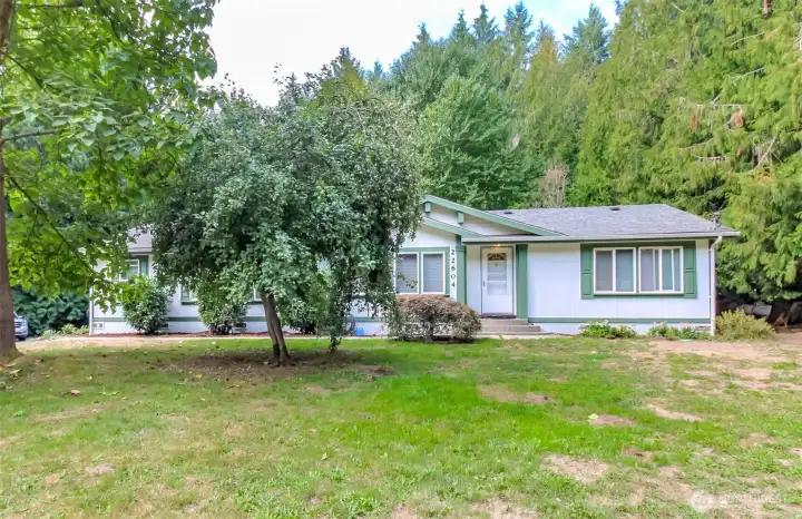 Charming home in a country setting nestled in the trees offering plenty of privacy on this huge 1.27 acre lot!