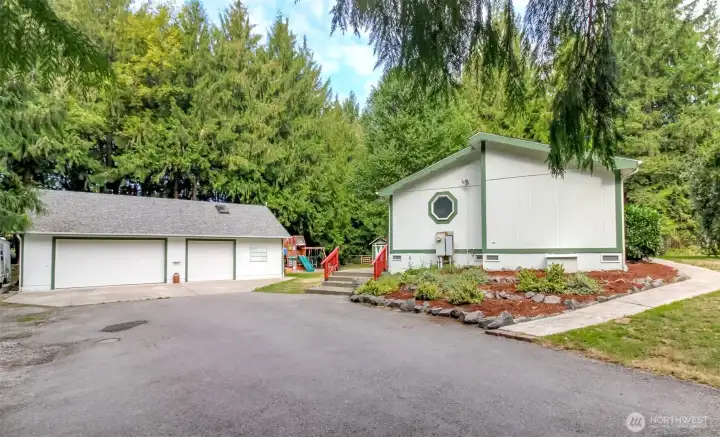 Massive 1300+ sq ft garage and heated shop with tons of parking and storage