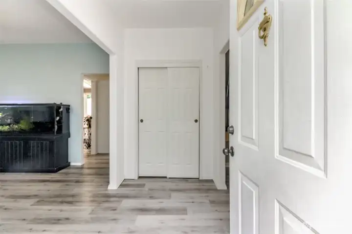 Entry with engendered wood flooring throughout the entire home