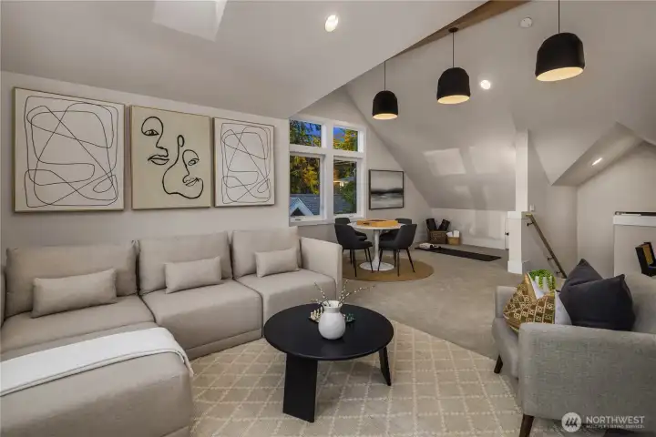 Large bonus great room with vaulted ceilings and stained wood beams