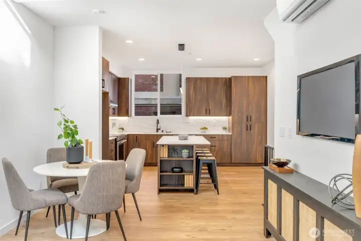 Looking in to the fabulous kitchen.  Note the amount of countertop/cabinet space!  Photo is of model home of same floorplan. Color schemes of finishes may vary.