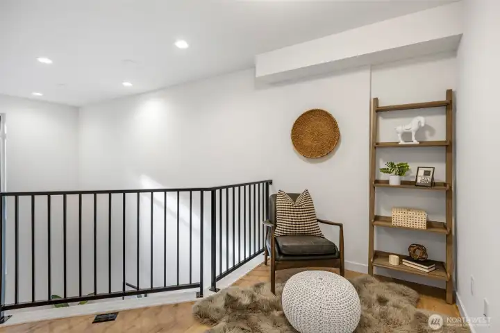Third level, has room for a reading nook, office perhaps (Your vision here!) Photo is of model home of same floorplan. Color schemes of finishes may vary.