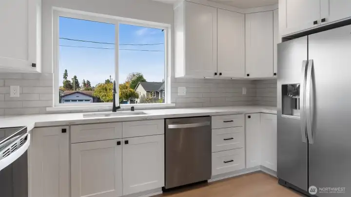Window over the sink offers so much light.