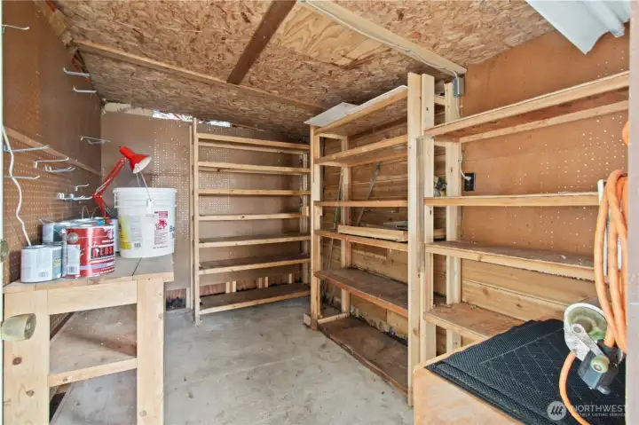Storage shed with ample shelving.