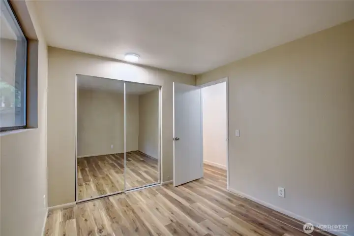 Brand New Mirrored Closet Doors in both bedrooms.  And new paint & flooring throughout.