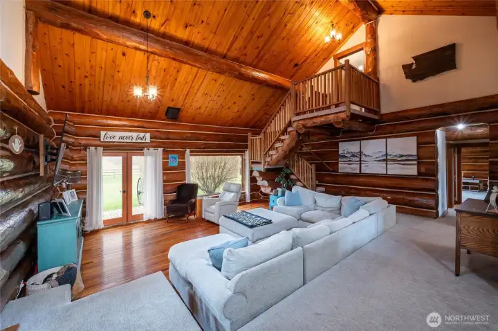 The sunken living room with vaulted ceilings
