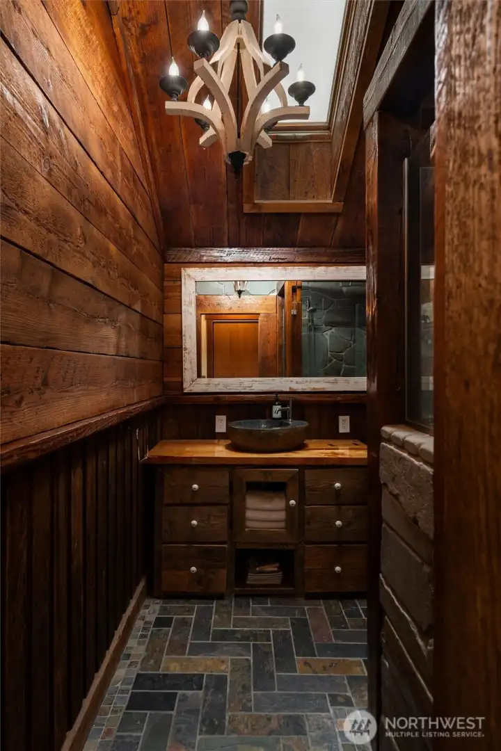 The upstairs bathroom attached to the primary suite