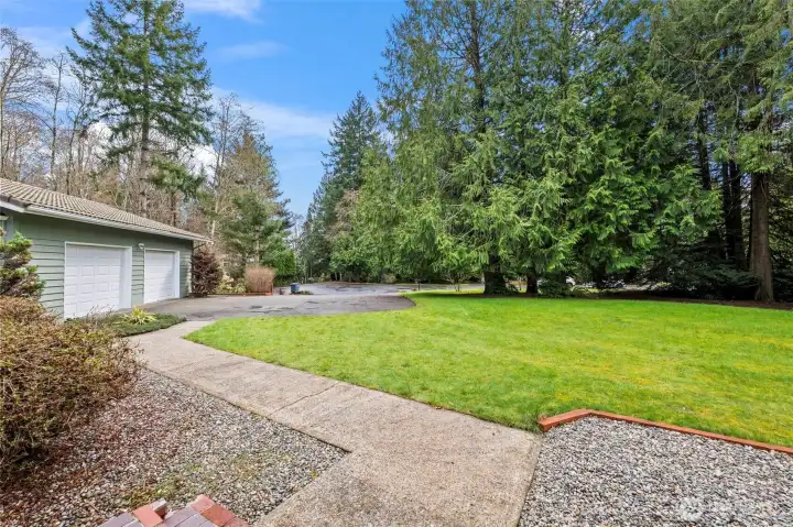 Front yard and view of the attached 2-car garage