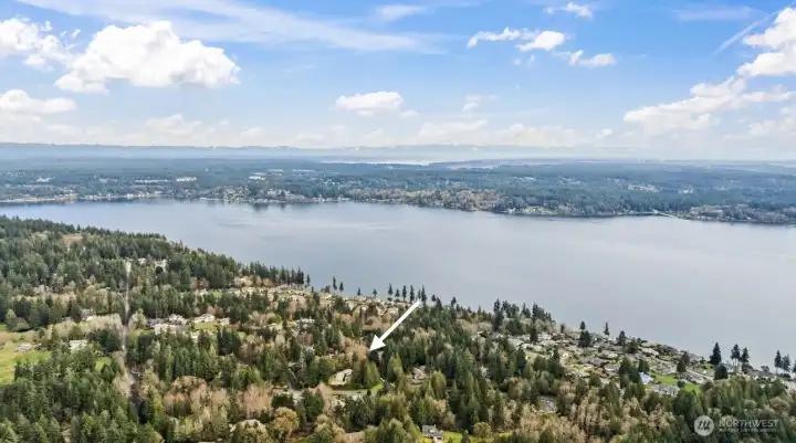 Aerial view of home and WindNTide Community looking out towards Henderson Bay.