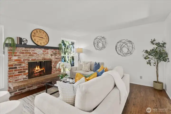 The main level living room is filled with natural light, creating a warm and inviting atmosphere.