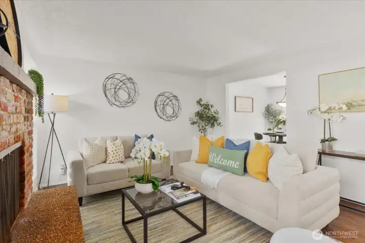 A cozy fireplace anchors the space, making it perfect for relaxing evenings at home. The layout offers a comfortable flow for both daily living and entertaining.