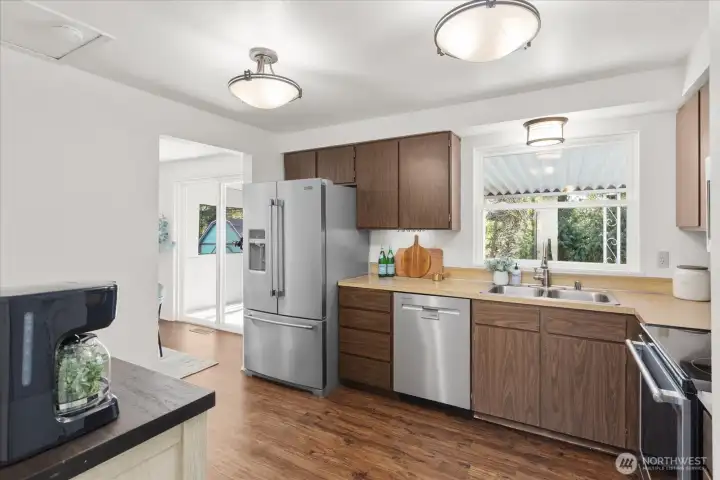 Whether you envision modern updates or a full transformation, the potential is undeniable. It sits conveniently adjacent to the dining area, keeping everything connected.