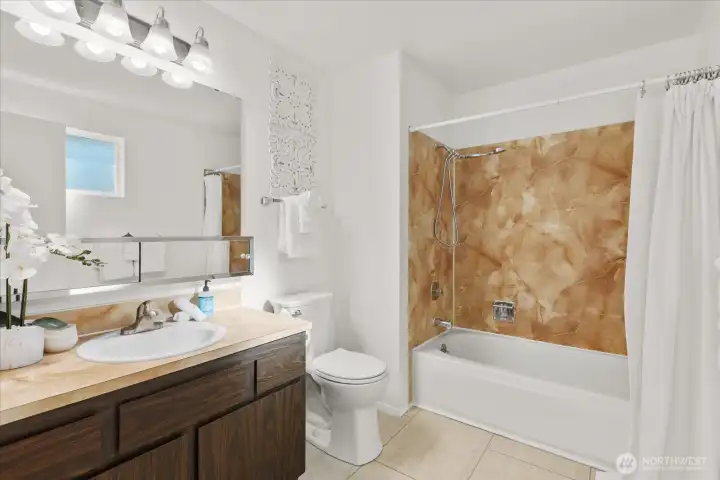 The ensuite bathroom adds convenience and privacy.