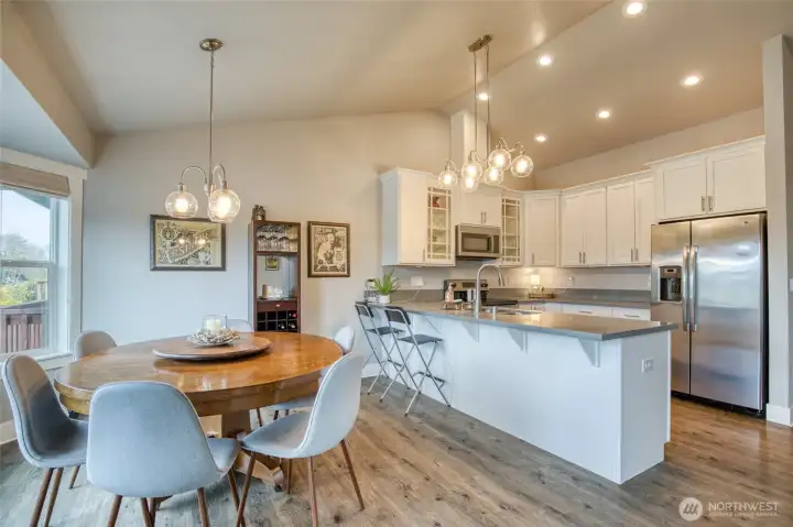 Open kitchen and dining room with bar seating
