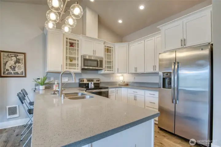 Granite slab countertops add elegance to this inviting kitchen