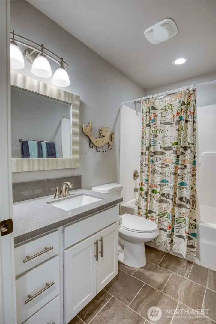 Between bedrooms 2 & 3 you will find the guest bathroom