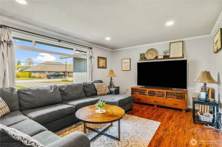 Living room with large window for lots of natural light.
